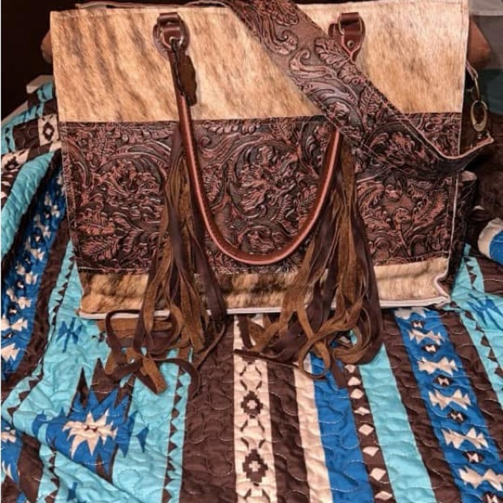 Brown and Tan Tote Bag with Embossed Patterns and Decorative Tassels